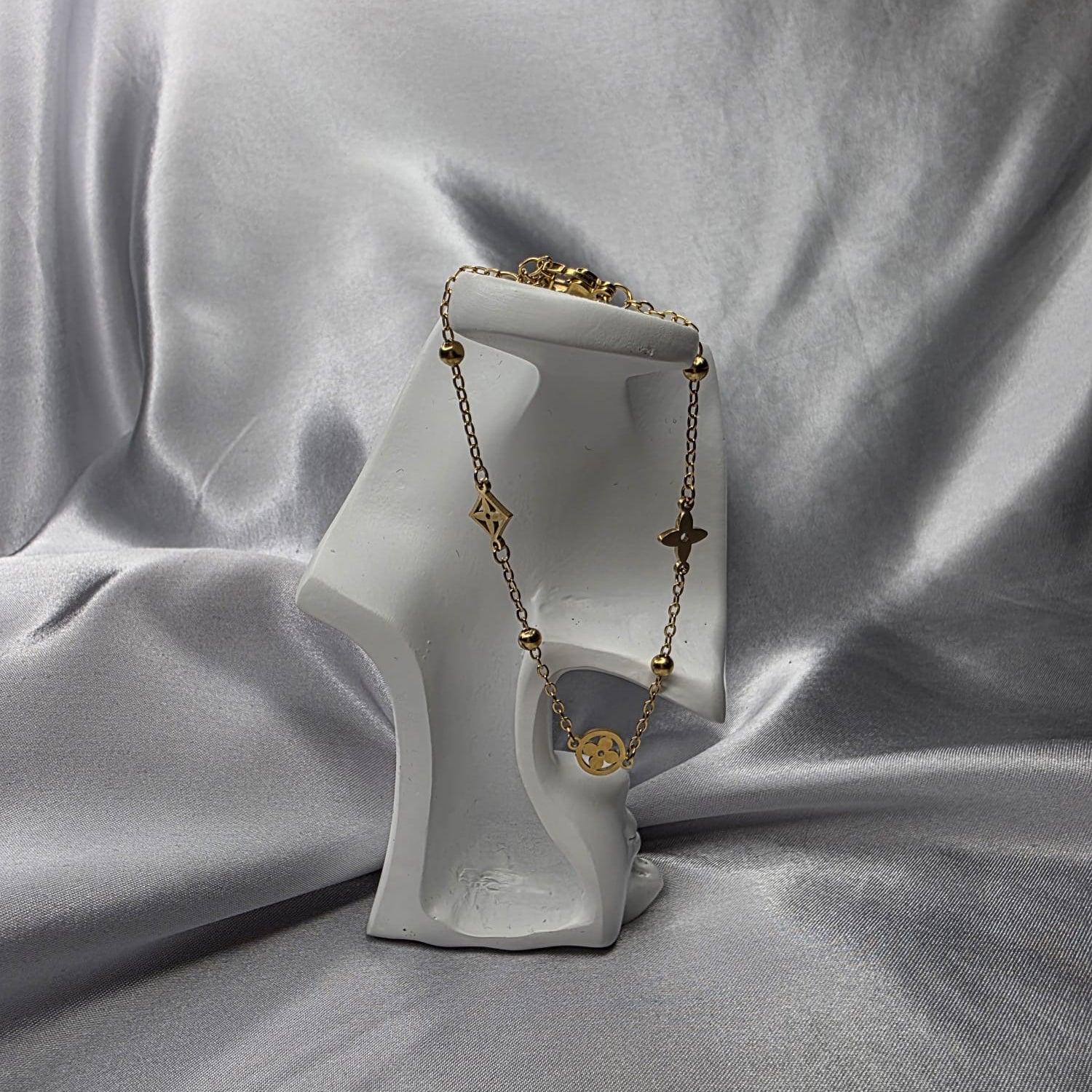 The Quatrefoil Charm Bracelet